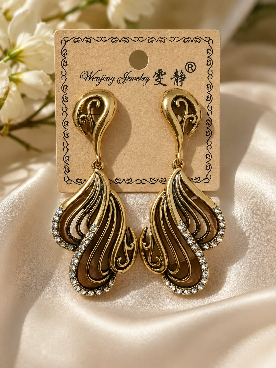 Hoor premium zircon earrings with elegant gold polish, lightweight design, and luxurious craftsmanship for weddings, Eid, and party wear.