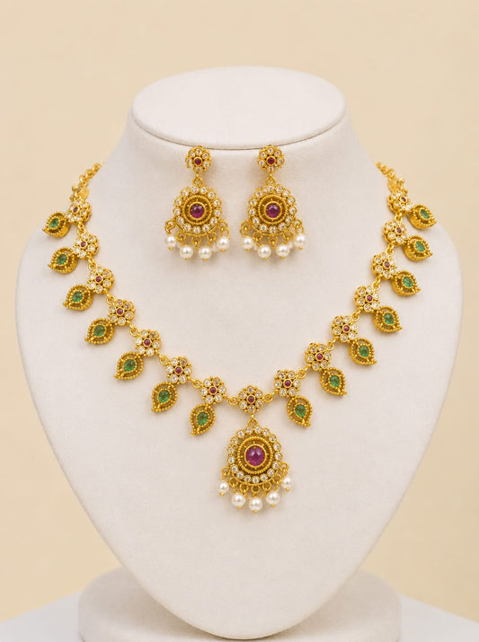 Shahi Noor traditional Pakistani gold jewelry set with green and pink gemstones and pearl accents