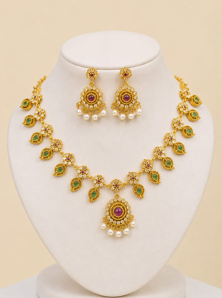 Shahi Noor traditional Pakistani gold jewelry set with green and pink gemstones and pearl accents